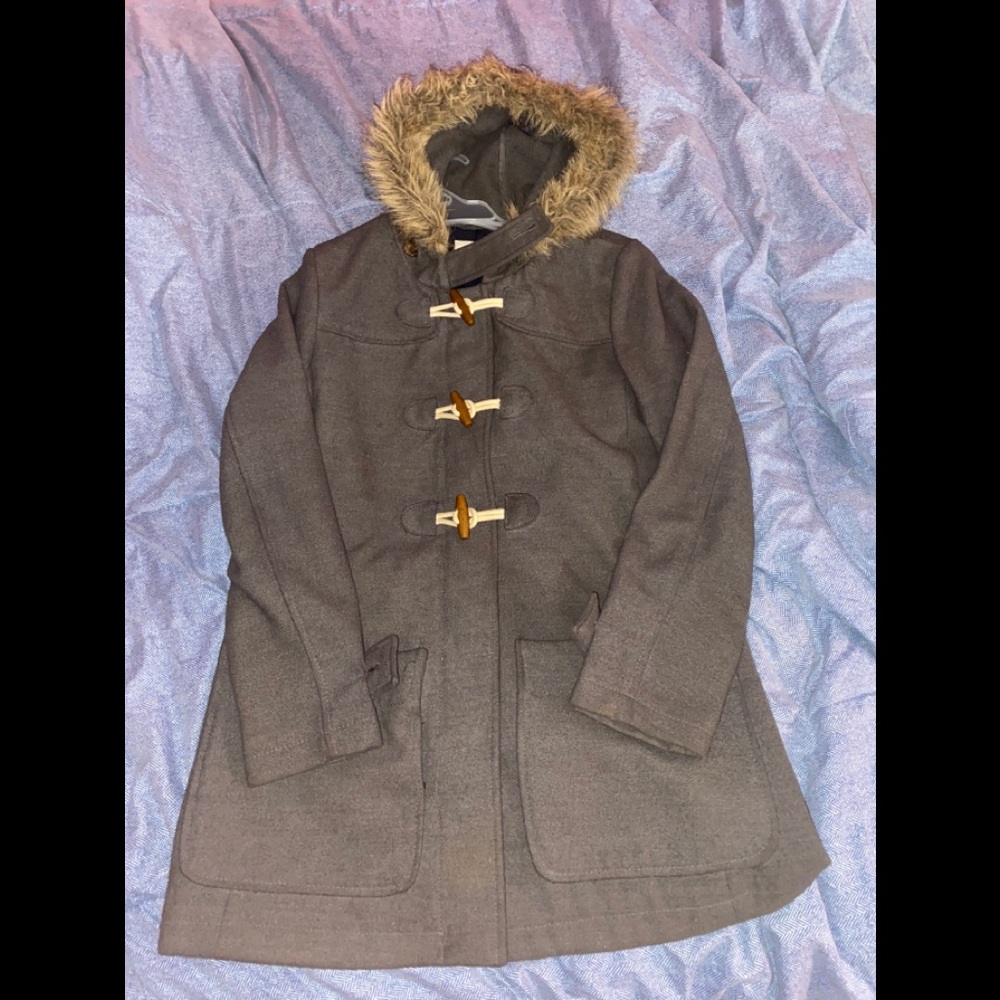 A Trench Coat With Faux Fur On The Hood